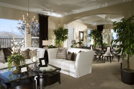 A well-decorated living room opens to a dining area.